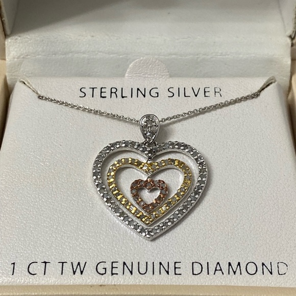 NWT sterling Silver tri color heart necklace.